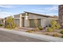 Contemporary home showcasing clean lines, low-maintenance landscaping, and an attached garage at 924 Mayfield Manor Ln, Las Vegas, NV 89138