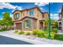 Two-story house with stone accents, tile roof, brown trim, well-manicured lawn, and a two-car garage at 12240 Old Muirfield St, Las Vegas, NV 89141