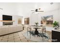 Bright living room with a fireplace, ceiling fan and a neutral color scheme that creates a cozy atmosphere at 1904 Monte Alban Dr, North Las Vegas, NV 89031