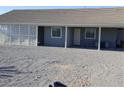 The backyard has a covered patio area with white lattice and desert landscaping, ready for customization at 2731 W Huron Ln, Pahrump, NV 89048