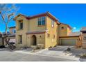 Two-story home with a private attached garage, desert landscaping, and a lovely, tree-lined street at 3932 Maldive Isle Ct, Las Vegas, NV 89129