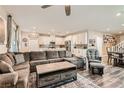 Open-concept living room and kitchen area featuring modern furniture and decor at 4813 Stony Hill St, North Las Vegas, NV 89031