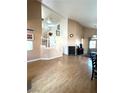 Spacious living room featuring high ceilings and wood-look floors at 5255 Autumn Sky Rd, Las Vegas, NV 89118