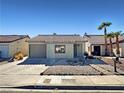 Inviting single-story home with desert landscaping and a cozy front porch at 592 Grimsby Ave, Henderson, NV 89014