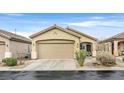 Single-story home featuring a two-car garage and desert landscaping at 6144 Corbin Ave, Las Vegas, NV 89122