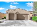 Inviting single story home with a two-car garage and a well maintained desert landscape at 6733 Fast Brook Ct, North Las Vegas, NV 89084