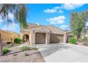 Attractive two-story home with a two-car garage and well maintained desert landscape at 6733 Fast Brook Ct, North Las Vegas, NV 89084