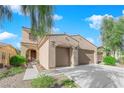 Inviting two-story home with a two-car garage and well maintained desert landscape at 6733 Fast Brook Ct, North Las Vegas, NV 89084