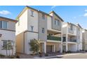 Modern two-story home featuring a welcoming balcony, and an attached two-car garage at 6855 Evening Orchid St, North Las Vegas, NV 89086