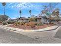 Corner lot home with mature trees, a yard, and a low-maintenance desert landscape at 700 Northstar St, Las Vegas, NV 89107