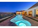 Enjoy the serenity of this uniquely shaped pool and spa, with beautiful landscaping and a peaceful waterfall feature at 8 Reverie Heights Ave, Henderson, NV 89011