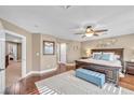 Serene main bedroom boasts hardwood floors, neutral tones, and an en-suite bathroom at 9435 Westwind Rd, Las Vegas, NV 89139