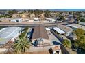 Aerial view of a single-story home with a fenced backyard, patio area and additional storage shed at 104 Sir George Dr, Las Vegas, NV 89110