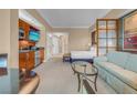 Comfortable living area featuring a kitchenette, seating area, and a view into the bedroom at 125 E Harmon Ave # 809, Las Vegas, NV 89109