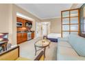 Comfortable living area featuring a kitchenette, seating area, and a view into the bedroom at 125 E Harmon Ave # 809, Las Vegas, NV 89109