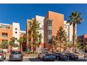 Contemporary condo building with modern design, colorful facade, and well-maintained landscaping at 19 E Agate Ave # 307, Las Vegas, NV 89123