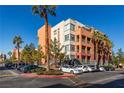 A stylish condo building boasts mature palm trees, meticulous landscaping, and ample parking space at 19 E Agate Ave # 307, Las Vegas, NV 89123