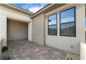 Contemporary home featuring a private patio, and brick pavers at 5015 Terramont Dr, Las Vegas, NV 89135