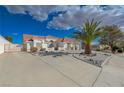 Expansive single-story home with a red tile roof, circular driveway, and stucco exterior at 519 Cayuga Ct, Boulder City, NV 89005