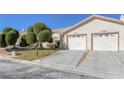 Charming home featuring a well-manicured lawn and a two-car garage, perfect for suburban living at 5732 Colwood Ln, Las Vegas, NV 89130