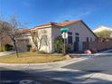 Corner lot home featuring a tile roof, desert landscaping, and a well-maintained lawn at 5965 Poplar Tree St, Las Vegas, NV 89148