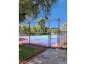 Well-maintained tennis court surrounded by greenery, offering a great space for sports and outdoor activities at 745 N Royal Crest Cir # 151, Las Vegas, NV 89169