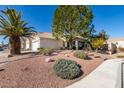 Single-story home featuring desert landscaping, mature trees, and a walkway leading to the front entrance at 7608 Little Valley Ave, Las Vegas, NV 89147