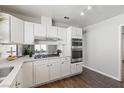 Well-lit kitchen with stainless steel appliances and views of the backyard at 8212 Ducharme Ave, Las Vegas, NV 89145