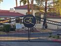 A close-up of the decorative gate at the entrance to the Enclaves community at 8455 W Sahara Ave # 258, Las Vegas, NV 89117