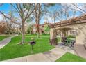 Community barbecue area with picnic tables and grassy landscaping at 9000 Las Vegas Blvd # 2138, Las Vegas, NV 89123