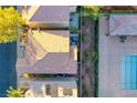 Overhead view of a backyard with a pool, patio, and lush landscaping at 9144 Epworth Ave, Las Vegas, NV 89148