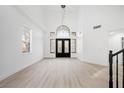 Spacious foyer with high ceilings and a black double-door entryway at 9795 La Cienega St, Las Vegas, NV 89183