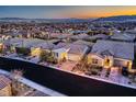 A high angle street view of charming single-Gathering homes featuring desert landscaping and mountain views at 11831 Saverio Ave, Las Vegas, NV 89138