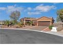 Beautiful home with desert landscaping, mature trees, and a two car garage at 1564 Fieldbrook St, Henderson, NV 89052