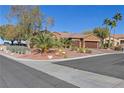 Beautiful home with desert landscaping, mature trees, and a two car garage at 1564 Fieldbrook St, Henderson, NV 89052