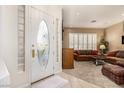 Inviting foyer showcases a decorative glass front door and neutral color palette at 2329 Quartz Peak St, Las Vegas, NV 89134