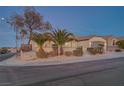 Attractive single-story home with desert landscaping, stone accents, and an attached two-car garage at 2820 Thunder Bay Ave, Henderson, NV 89052