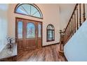 Elegant foyer with wood-look floors, stained glass door, and decorative trim at 4075 E Oquendo Rd, Las Vegas, NV 89120