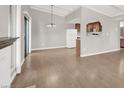 View of open dining area with adjacent kitchen and patio door at 4722 Obannon Dr # D, Las Vegas, NV 89102