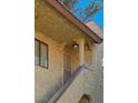 Exterior view of home with tiled roof, stucco, and landscaped entry at 4722 Obannon Dr # D, Las Vegas, NV 89102