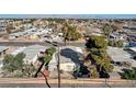 Aerial view showcasing the property's surroundings within a vibrant community and mountain views at 5217 Sir James Way, Las Vegas, NV 89110