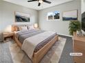 Cozy bedroom with a comfortable bed, natural light, and neutral decor at 6421 Dinning Ave, Las Vegas, NV 89107