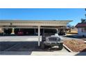 Carport view showing parking, metal roof, and surrounding vehicles at 701 Bourbon St # G3, Pahrump, NV 89048