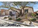 Single-story home featuring desert landscaping and a two-car garage at 7153 Tavita St, Las Vegas, NV 89113