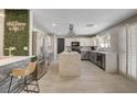 Spacious kitchen with stainless steel appliances, a large island, and plenty of natural light at 2010 Spruce Brook Dr, Henderson, NV 89074