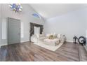 Bright living room featuring hardwood floors, neutral colors, and modern decor at 2241 Verde Cape Ave, Henderson, NV 89052