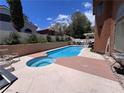 Backyard pool and spa with ample seating area and landscaping offering a private retreat at 2913 Domino Way, Las Vegas, NV 89117