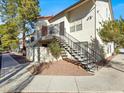 Exterior of building featuring covered stairwells and mature trees at 3682 Melonies Dr # 5, Las Vegas, NV 89103
