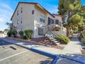 Exterior of building featuring covered stairwells, parking and mature trees at 3682 Melonies Dr # 5, Las Vegas, NV 89103