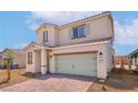 Attractive two-story home featuring a paved driveway, desert landscaping, and inviting curb appeal at 6737 Violet Cascade Ave, Las Vegas, NV 89156